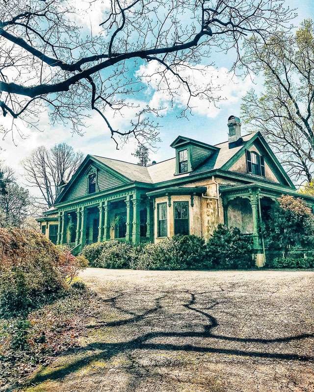 Oakton, Marietta Georgia. Historic home, green painted architectural details, front and side southern porch.
